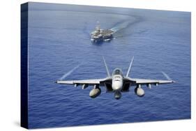 An F-A-18E Super Hornet Flying Above USS John C. Stennis-null-Stretched Canvas