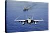 An F-A-18E Super Hornet Flying Above USS John C. Stennis-null-Stretched Canvas