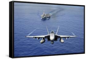 An F-A-18E Super Hornet Flying Above USS John C. Stennis-null-Framed Stretched Canvas