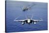 An F-A-18E Super Hornet Flying Above USS John C. Stennis-null-Stretched Canvas