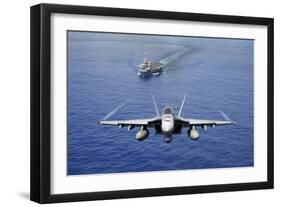 An F-A-18E Super Hornet Flying Above USS John C. Stennis-null-Framed Premium Photographic Print