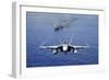 An F-A-18E Super Hornet Flying Above USS John C. Stennis-null-Framed Premium Photographic Print