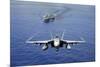 An F-A-18E Super Hornet Flying Above USS John C. Stennis-null-Mounted Photographic Print