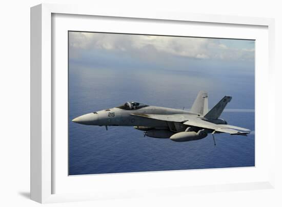 An F-A-18E Super Hornet over the Pacific Ocean-null-Framed Photographic Print