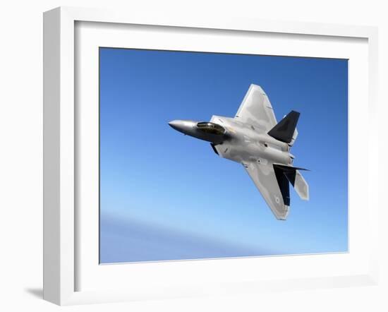 An F/A-22 Raptor Banks During a Training Sortie-Stocktrek Images-Framed Photographic Print