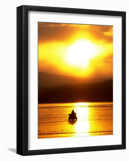 An Ice Fisherman Motors Across the Frozen Surface of Lake Champlain Near the Milton-South Hero, VT.-null-Framed Photographic Print