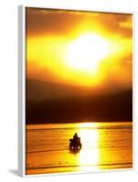 An Ice Fisherman Motors Across the Frozen Surface of Lake Champlain Near the Milton-South Hero, VT.-null-Framed Photographic Print