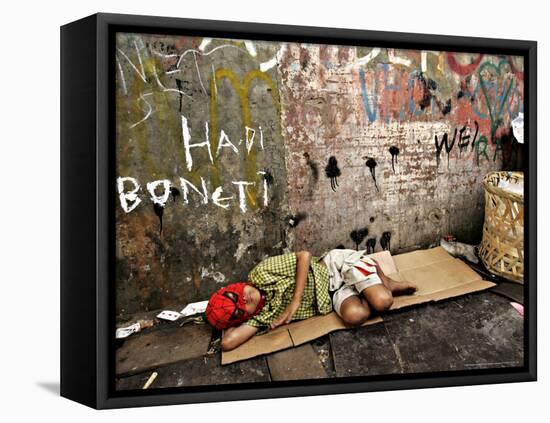 An Indonesian Boy Wearing a Spiderman Mask Sleeps on a Piece of Cardboard-Ed Wray-Framed Stretched Canvas