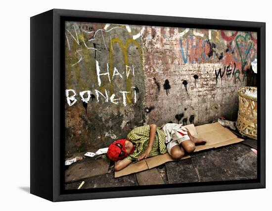 An Indonesian Boy Wearing a Spiderman Mask Sleeps on a Piece of Cardboard-Ed Wray-Framed Stretched Canvas