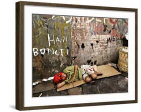 An Indonesian Boy Wearing a Spiderman Mask Sleeps on a Piece of Cardboard-Ed Wray-Framed Photographic Print