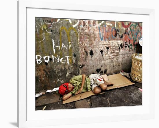 An Indonesian Boy Wearing a Spiderman Mask Sleeps on a Piece of Cardboard-Ed Wray-Framed Photographic Print