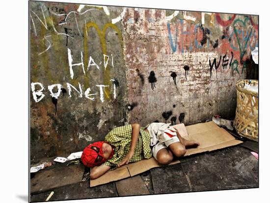 An Indonesian Boy Wearing a Spiderman Mask Sleeps on a Piece of Cardboard-Ed Wray-Mounted Photographic Print