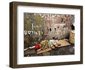 An Indonesian Boy Wearing a Spiderman Mask Sleeps on a Piece of Cardboard-Ed Wray-Framed Photographic Print