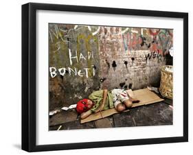 An Indonesian Boy Wearing a Spiderman Mask Sleeps on a Piece of Cardboard-Ed Wray-Framed Photographic Print