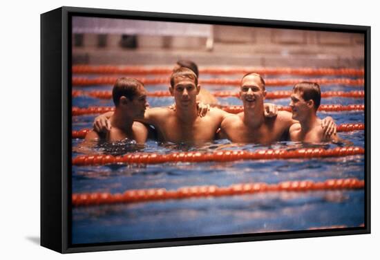 An Intercollegiate Team Locks Arms after Winning Medley Relay, 1964 Summer Olympics, Tokyo, Japa-Art Rickerby-Framed Stretched Canvas