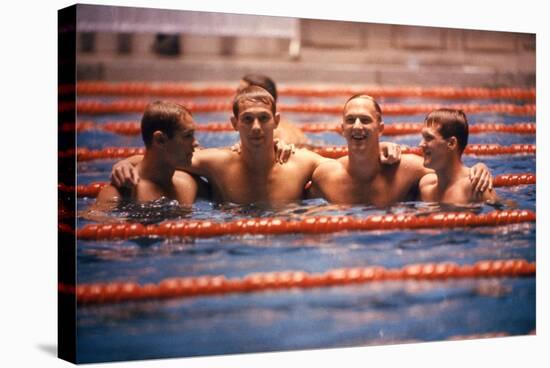 An Intercollegiate Team Locks Arms after Winning Medley Relay, 1964 Summer Olympics, Tokyo, Japa-Art Rickerby-Stretched Canvas