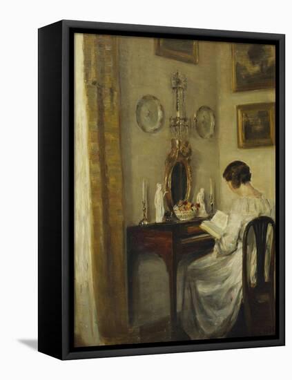 An Interior with a Girl Reading at a Desk-Carl Holsoe-Framed Stretched Canvas