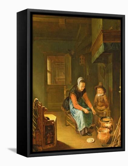 An Interior with a Woman Cooking Pancakes with a Young Boy before a Hearth-Pieter van Slingelandt-Framed Stretched Canvas
