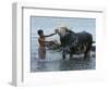 An Iraqi Boy Washes a Water Buffalo-null-Framed Photographic Print