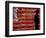 An Man Wearing a Cowboy Hat Walks Past an American Flag Light Display-Brandi Simons-Framed Photographic Print