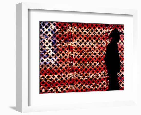 An Man Wearing a Cowboy Hat Walks Past an American Flag Light Display-Brandi Simons-Framed Photographic Print