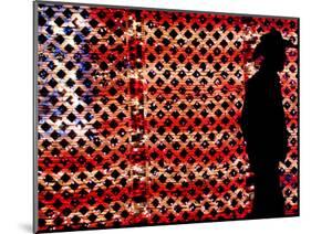 An Man Wearing a Cowboy Hat Walks Past an American Flag Light Display-Brandi Simons-Mounted Photographic Print