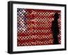 An Man Wearing a Cowboy Hat Walks Past an American Flag Light Display-Brandi Simons-Framed Photographic Print