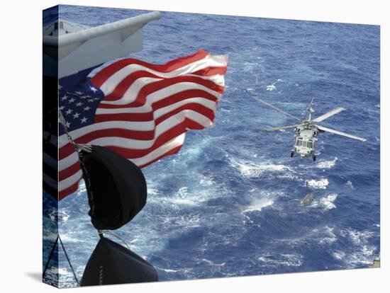 An Mh-60S Sea Hawk Carries Supplies During a Replenishment at Sea-null-Stretched Canvas