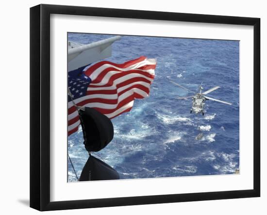 An Mh-60S Sea Hawk Carries Supplies During a Replenishment at Sea-null-Framed Photographic Print