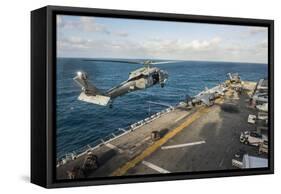 An Mh-60S Sea Hawk Helicopter Delivers Supplies to USS Bonhomme Richard-null-Framed Stretched Canvas