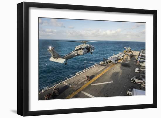 An Mh-60S Sea Hawk Helicopter Delivers Supplies to USS Bonhomme Richard-null-Framed Photographic Print