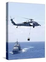 An Mh-60S Sea Hawk Helicopter Flying in Front of USS Gettysburg-null-Stretched Canvas