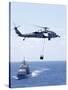 An Mh-60S Sea Hawk Helicopter Flying in Front of USS Gettysburg-null-Stretched Canvas