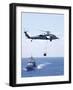 An Mh-60S Sea Hawk Helicopter Flying in Front of USS Gettysburg-null-Framed Photographic Print