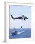 An Mh-60S Sea Hawk Helicopter Flying in Front of USS Gettysburg-null-Framed Photographic Print