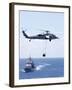 An Mh-60S Sea Hawk Helicopter Flying in Front of USS Gettysburg-null-Framed Photographic Print