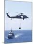 An Mh-60S Sea Hawk Helicopter Flying in Front of USS Gettysburg-null-Mounted Photographic Print