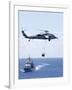 An Mh-60S Sea Hawk Helicopter Flying in Front of USS Gettysburg-null-Framed Photographic Print