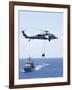 An Mh-60S Sea Hawk Helicopter Flying in Front of USS Gettysburg-null-Framed Photographic Print