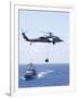 An Mh-60S Sea Hawk Helicopter Flying in Front of USS Gettysburg-null-Framed Photographic Print