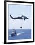 An Mh-60S Sea Hawk Helicopter Flying in Front of USS Gettysburg-null-Framed Photographic Print