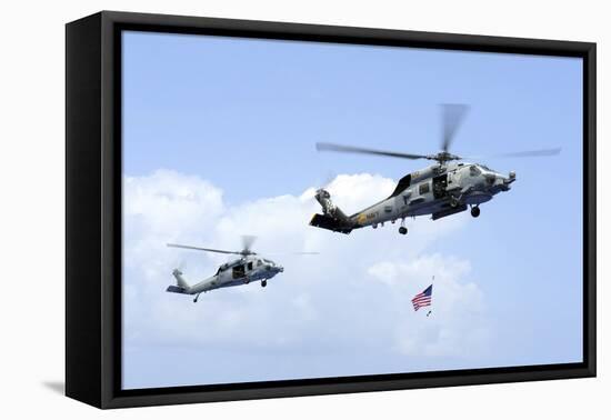 An Mh-60S Sea Hawk Helicopter Follows Behind an Mh-60R Sea Hawk-null-Framed Stretched Canvas