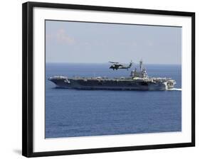 An MH-60S Seahawk Helicopter Flies over USS George H.W. Bush-Stocktrek Images-Framed Photographic Print