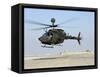 An Oh-58D Kiowa Warrior Hovers over the Flight Line at Camp Speicher, Iraq-null-Framed Stretched Canvas