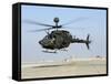 An Oh-58D Kiowa Warrior Hovers over the Flight Line at Camp Speicher, Iraq-null-Framed Stretched Canvas