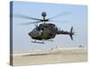 An Oh-58D Kiowa Warrior Hovers over the Flight Line at Camp Speicher, Iraq-null-Stretched Canvas