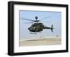 An Oh-58D Kiowa Warrior Hovers over the Flight Line at Camp Speicher, Iraq-null-Framed Photographic Print