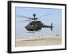 An Oh-58D Kiowa Warrior Hovers over the Flight Line at Camp Speicher, Iraq-null-Framed Photographic Print