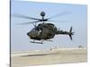 An Oh-58D Kiowa Warrior Hovers over the Flight Line at Camp Speicher, Iraq-null-Stretched Canvas