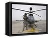 An Oh-58D Kiowa Warrior Pilot Stands Beside His Aircraft-null-Framed Stretched Canvas
